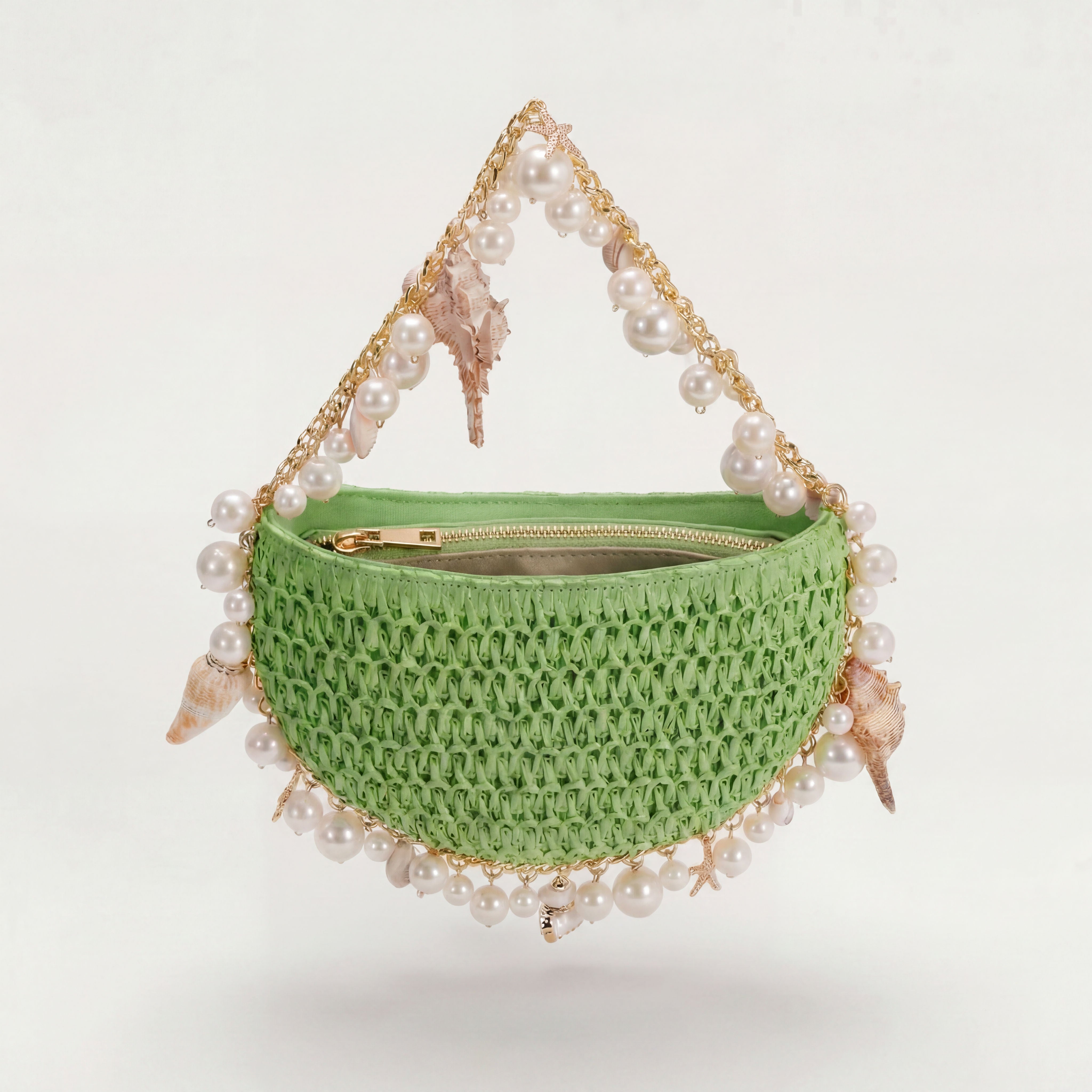 Mint green raffia mini shoulder bag with gold hardware, side view, Bahari