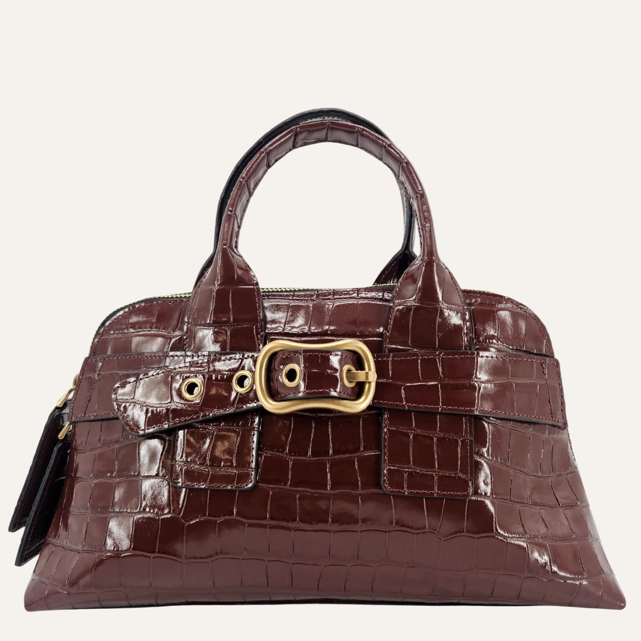 Brown crocodile-patterned handbag with a gold buckle on a white background