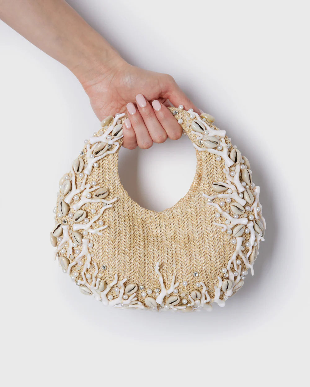 Detail of the shell and crystal embroidery on Emily Cooper's bag. As featured in the costume design for Emily in Paris Season 5, Rome storyline.